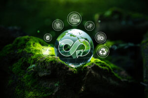 Crystal globe with circular economy icon on moss